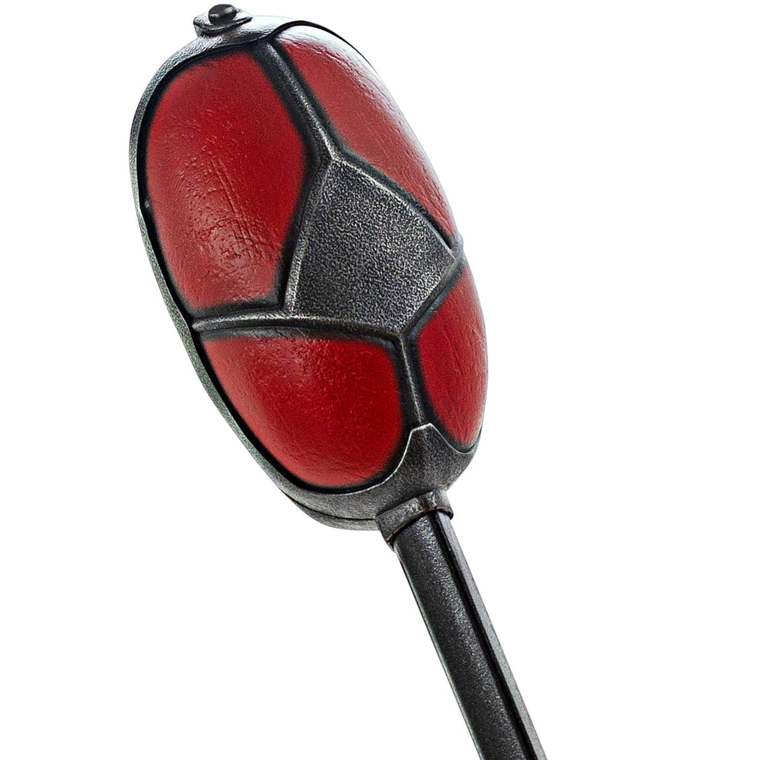 Close-up of a red and black Sword handle on a white background