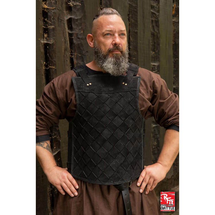 The black RFB leather armor worn by a Viking man from the front